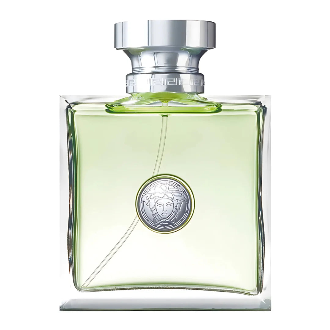 Green perfume bottle with silver cap on a white background
